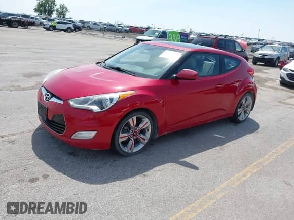 2013 Hyundai Veloster w/Black Int z VIN KMHTC6AD2DU146306, wystawiony jako IAAI lot #42943659 z przebiegiem 125 817 mil mil oraz . Historia ofert i sprzedaży dostępna na DreamBid. Obrazek 2.