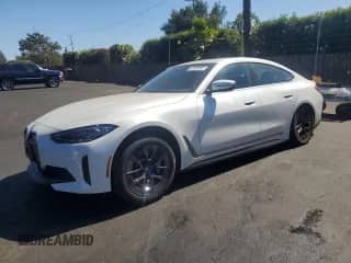 2022 BMW i4 eDrive40 with VIN WBY73AW01NFM83830, listed as a Copart auction lot 67808055 with 19,938 mi miles and Salvage title. Bid and sale history available at DreamBid. Image 1.