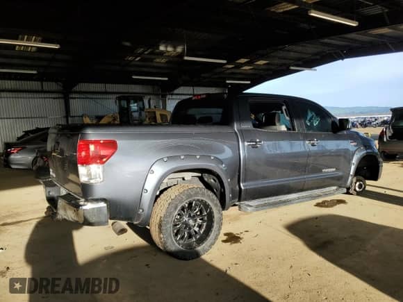 2010 Toyota Tundra Limited z VIN 5TFFY5F16AX091624, wystawiony jako Copart lot #49898515 z przebiegiem Nie podano mil oraz Szkoda całkowita • Salvage title. Historia ofert i sprzedaży dostępna na DreamBid. Obrazek 3.