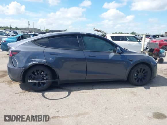 2023 Tesla Model Y Long Range with VIN 7SAYGDEE8PA163534, listed as a IAAI auction lot 42795393 with 45,172 mi miles and . Bid and sale history available at DreamBid. Image 12.