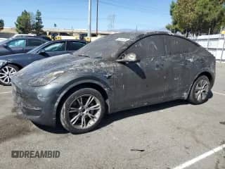 2023 Tesla Model Y Long Range with VIN 7SAYGDEEXPF847021, listed as a Copart auction lot 82144155 with 27,862 mi miles and Non repairable. Bid and sale history available at DreamBid. Image 1.