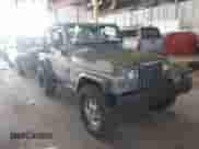 2005 Jeep Wrangler SE z VIN 1J4FA29115P314084, wystawiony jako IAAI lot #42149589 z przebiegiem 138 206 mil mil oraz . Historia ofert i sprzedaży dostępna na DreamBid. Obrazek 1.