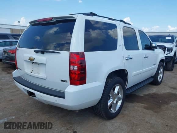 2007 Chevrolet Tahoe LTZ with VIN 1GNFC13027R338743, listed as a IAAI auction lot 43015789 with 168,315 mi miles and . Bid and sale history available at DreamBid. Image 4.