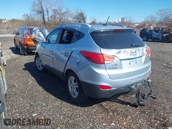 2012 Hyundai Tucson GLS with VIN KM8JU3AC3CU469367, listed as a IAAI auction lot 38512319 with 185,441 mi miles and . Bid and sale history available at DreamBid. Image 3.