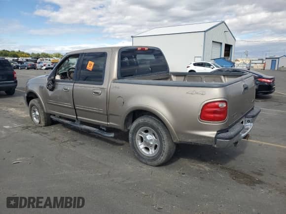 2003 Ford F-150 XLT with VIN 1FTRW08L93KB25558, listed as a Copart auction lot 81910345 with 169,885 mi miles and Salvage title. Bid and sale history available at DreamBid. Image 2.