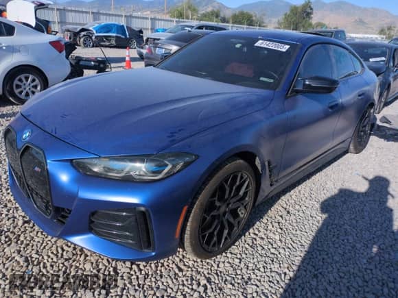 2023 BMW i4 M50 with VIN WBY33AW06PFN71595, listed as a Copart auction lot 61422005 with 34,241 mi miles and Salvage title. Bid and sale history available at DreamBid. Image 1.