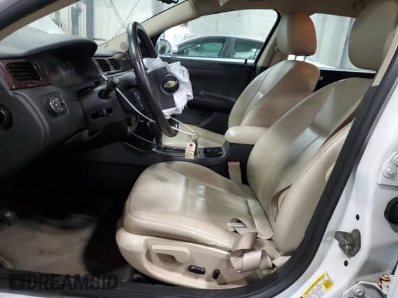 2012 Chevrolet Impala LTZ with VIN 2G1WC5E36C1332186, listed as a Copart auction lot 62693225 with 162,202 mi miles and Salvage title. Bid and sale history available at DreamBid. Image 7.