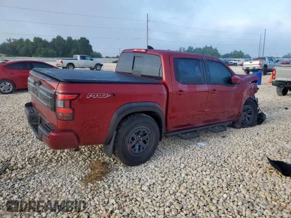 2025 Nissan Frontier Pro-X with VIN 1N6ED1EJXSN637854, listed as a Copart auction lot 65409335 with 2,410 mi miles and Salvage title. Bid and sale history available at DreamBid. Image 3.