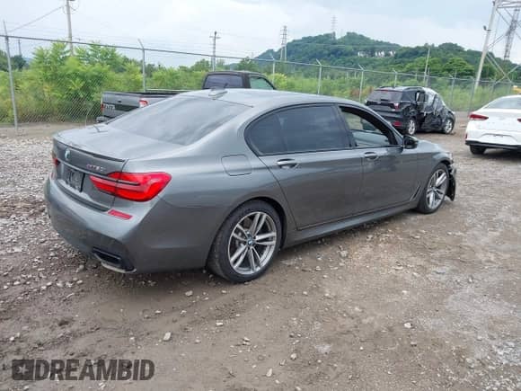 2016 BMW 7 Series 750i xDrive with VIN WBA7F2C58GG415114, listed as a IAAI auction lot 42627693 with 87,908 mi miles and . Bid and sale history available at DreamBid. Image 4.