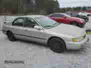 1996 Honda Accord with VIN 1HGCE6647TA010021, listed as a Copart auction lot 86294974 with 162,400 mi miles and Salvage title. Bid and sale history available at DreamBid. Image 4.