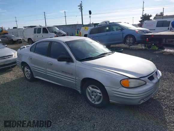 2001 Pontiac Grand Am SE1 with VIN 1G2NF52TX1M560650, listed as a IAAI auction lot 41654339 with 122,885 mi miles and . Bid and sale history available at DreamBid. Image 1.