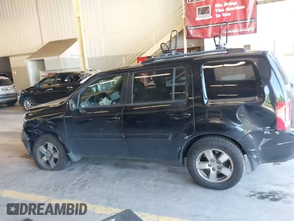 2011 Honda Pilot EX with VIN 5FNYF4H46BB015915, listed as a IAAI auction lot 42732489 with 222,665 mi miles and . Bid and sale history available at DreamBid. Image 14.