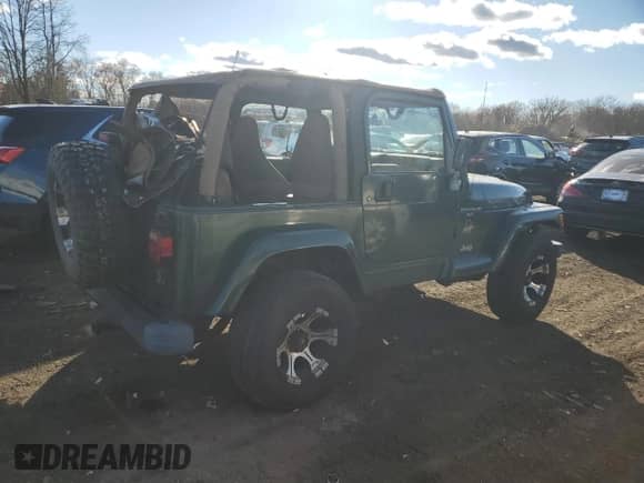 2001 Jeep Wrangler Sahara with VIN 1J4FA59S31P324555, listed as a Copart auction lot 80100734 with 136,973 mi miles and Clean title. Bid and sale history available at DreamBid. Image 3.