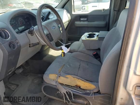 2005 Ford F-150 XLT with VIN 1FTRW14W55FA44896, listed as a Copart auction lot 71074945 with 284,443 mi miles and Salvage title. Bid and sale history available at DreamBid. Image 7.