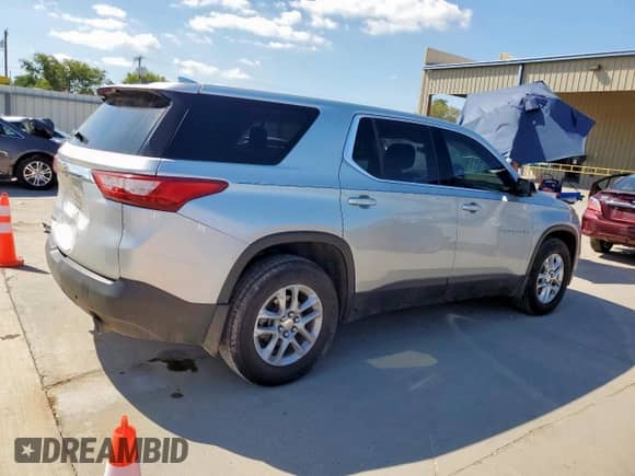 2018 Chevrolet Traverse LS с VIN 1GNERFKW9JJ143404, выставлен на аукционе Copart как лот 71166085 с пробегом 184 666 миль миль и Списание • Salvage title. История ставок и продаж доступна на DreamBid. Изображение 3.