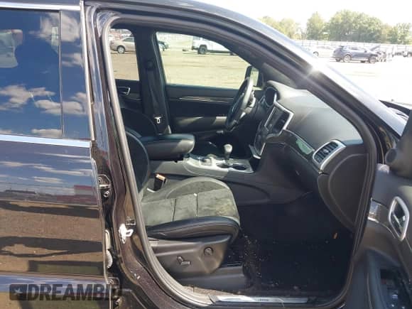 2015 Jeep Grand Cherokee SRT with VIN 1C4RJFDJ4FC853745, listed as a IAAI auction lot 43327828 with 68,614 mi miles and . Bid and sale history available at DreamBid. Image 5.