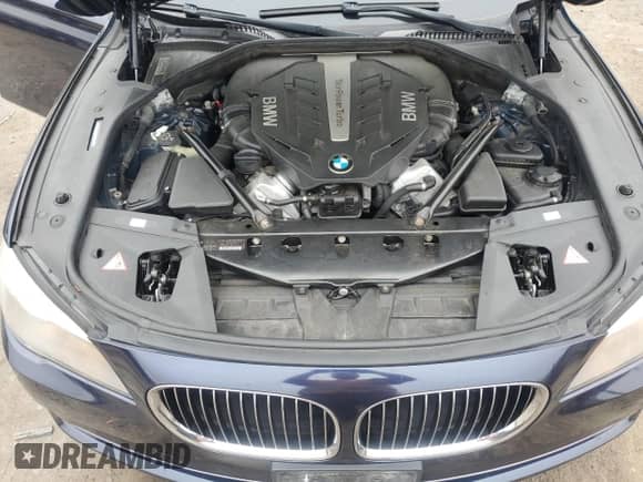 2012 BMW 7 Series 750i xDrive with VIN WBAKC6C52CDX99493, listed as a Copart auction lot 69933035 with 117,809 mi miles and Salvage title. Bid and sale history available at DreamBid. Image 11.