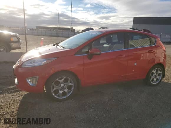 2012 Ford Fiesta SES with VIN 3FADP4FJ0CM174727, listed as a Copart auction lot 86832155 with 135,586 mi miles and Salvage title. Bid and sale history available at DreamBid. Image 1.