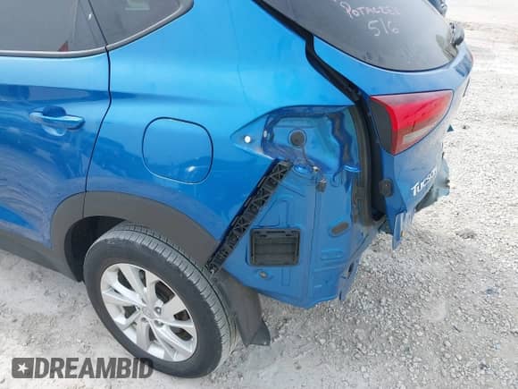 2019 Hyundai Tucson SE z VIN KM8J23A40KU886328, wystawiony jako IAAI lot #39500657 z przebiegiem 56 117 mil mil oraz . Historia ofert i sprzedaży dostępna na DreamBid. Obrazek 21.