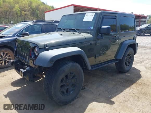 2015 Jeep Wrangler Sport with VIN 1C4AJWAG1FL714131, listed as a IAAI auction lot 42112376 with 81,998 mi miles and . Bid and sale history available at DreamBid. Image 2.