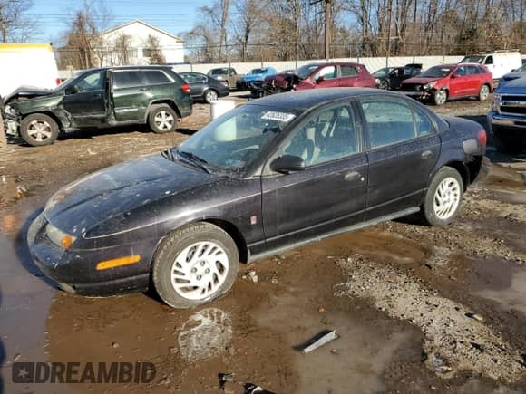 2000 Saturn SL with VIN 1G8ZH5283YZ169267, listed as a Copart auction lot 42626335 with 131,556 mi miles and Salvage title. Bid and sale history available at DreamBid. Image 1.