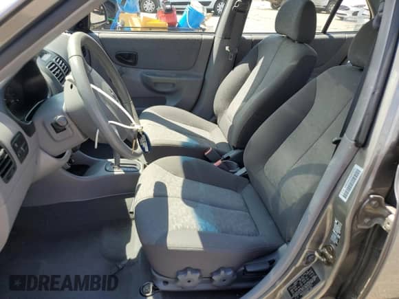 2003 Hyundai Accent GL z VIN KMHCG45C63U476751, wystawiony jako Copart lot #66774675 z przebiegiem 113 600 mil mil oraz Szkoda całkowita • Salvage title. Historia ofert i sprzedaży dostępna na DreamBid. Obrazek 7.