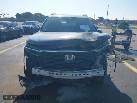 2025 Honda Pilot Touring с VIN 5FNYG2H72SB014420, выставлен на аукционе IAAI как лот 42332505 с пробегом 20 172 миль миль и . История ставок и продаж доступна на DreamBid. Изображение 13.