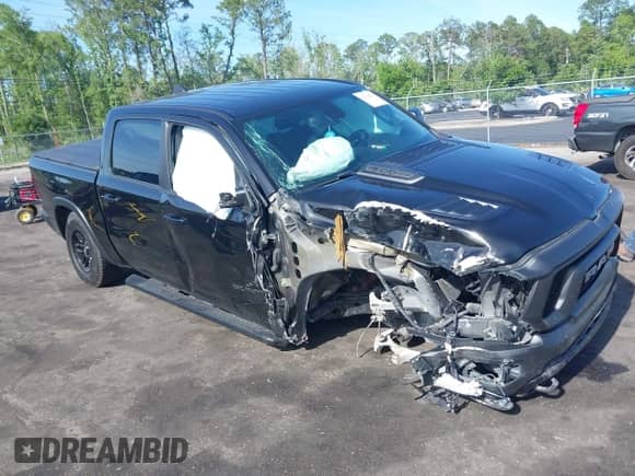 2019 Ram 1500 Rebel z VIN 1C6SRFLT3KN630552, wystawiony jako IAAI lot #42184521 z przebiegiem 126 934 mil mil oraz . Historia ofert i sprzedaży dostępna na DreamBid. Obrazek 1.