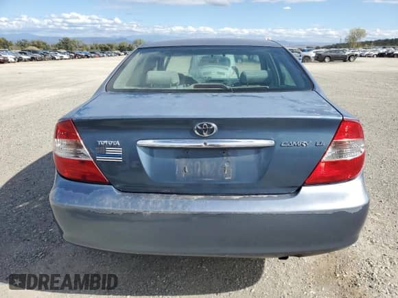 2003 Toyota Camry LE z VIN 4T1BE32K13U747870, wystawiony jako Copart lot #86464215 z przebiegiem 210 375 mil mil oraz Szkoda całkowita • Salvage title. Historia ofert i sprzedaży dostępna na DreamBid. Obrazek 6.
