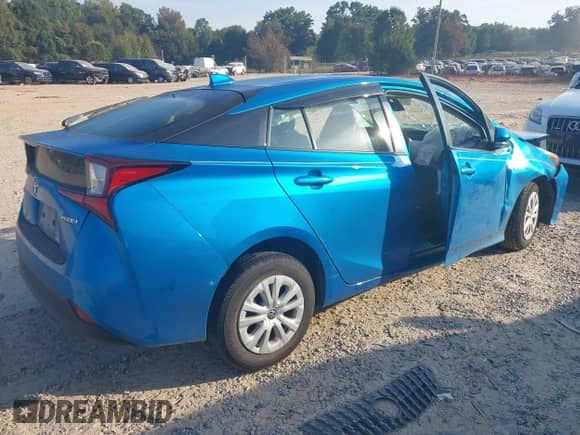 2021 Toyota Prius L Eco with VIN JTDKAMFU1M3136133, listed as a IAAI auction lot 43285926 with 49,911 mi miles and . Bid and sale history available at DreamBid. Image 4.