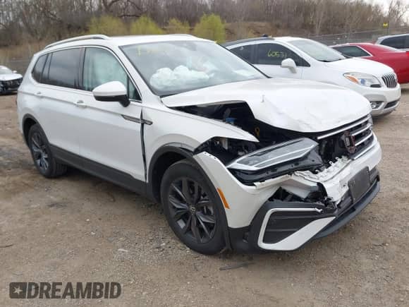 2023 Volkswagen Tiguan SE with VIN 3VVNB7AX4PM100180, listed as a IAAI auction lot 42062208 with 12,922 mi miles and . Bid and sale history available at DreamBid. Image 1.