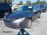 2003 Toyota Camry LE with VIN JTDBE32K530180767, listed as a IAAI auction lot 43276458 with 189,568 mi miles and . Bid and sale history available at DreamBid. Image 6.