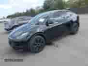 2024 Tesla Model Y with VIN 7SAYGDED8RF156984, listed as a IAAI auction lot 43324819 with 26,941 mi miles and . Bid and sale history available at DreamBid. Image 2.