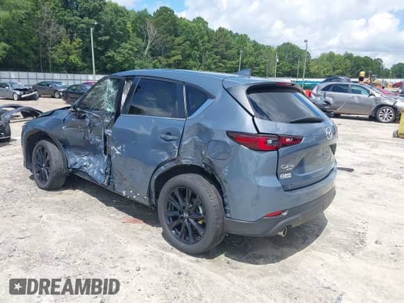 2023 Mazda CX-5 S Carbon Edition z VIN JM3KFBCM3P0262534, wystawiony jako IAAI lot #42740448 z przebiegiem 10 257 mil mil oraz . Historia ofert i sprzedaży dostępna na DreamBid. Obrazek 3.
