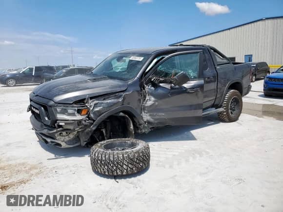 2020 Ram 1500 Rebel z VIN 1C6SRFLT2LN199221, wystawiony jako Copart lot #68965755 z przebiegiem 49 714 mil mil oraz Szkoda całkowita • Salvage title. Historia ofert i sprzedaży dostępna na DreamBid. Obrazek 1.