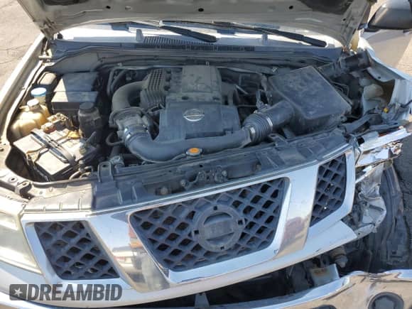 2006 Nissan Frontier SE z VIN 1N6AD07W96C449524, wystawiony jako Copart lot #70152475 z przebiegiem 206 553 mil mil oraz Szkoda całkowita • Salvage title. Historia ofert i sprzedaży dostępna na DreamBid. Obrazek 11.