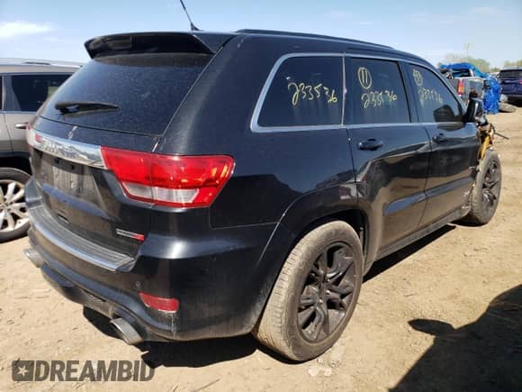 2012 Jeep Grand Cherokee SRT-8 z VIN 1C4RJFDJ2CC352056, wystawiony jako Copart lot #48810994 z przebiegiem 114 807 mil mil oraz Szkoda całkowita • Salvage title. Historia ofert i sprzedaży dostępna na DreamBid. Obrazek 3.