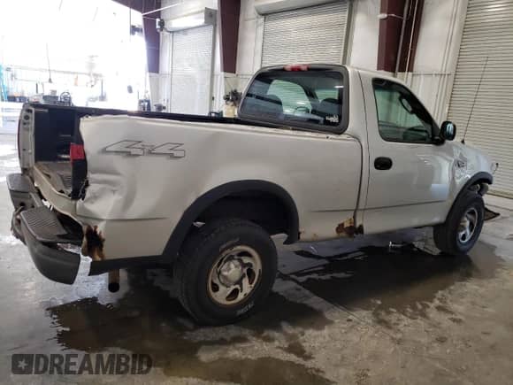 2003 Ford F-150 XL z VIN 1FTRF18273NB92414, wystawiony jako Copart lot #71539794 z przebiegiem Nie podano mil oraz Szkoda całkowita • Salvage title. Historia ofert i sprzedaży dostępna na DreamBid. Obrazek 3.