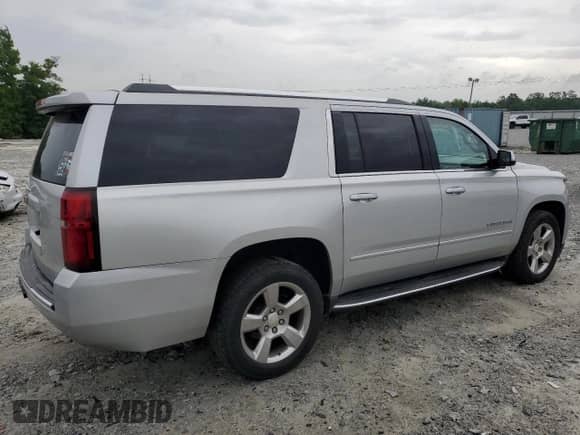 2017 Chevrolet Suburban Premier with VIN 1GNSCJKC1HR212823, listed as a Copart auction lot 58086455 with 164,130 mi miles and Salvage title. Bid and sale history available at DreamBid. Image 3.