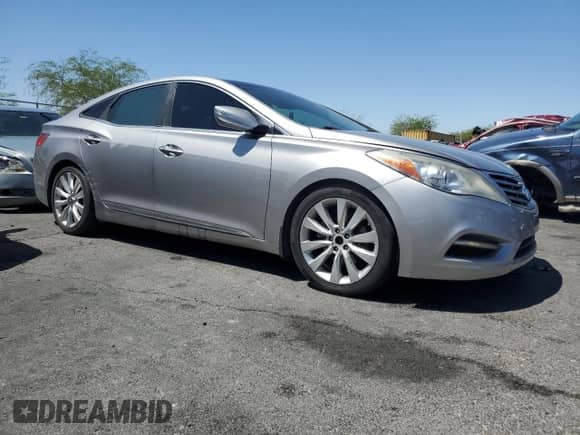 2013 Hyundai Azera with VIN KMHFH4JG6DA199492, listed as a Copart auction lot 61403195 with 107,506 mi miles and Salvage title. Bid and sale history available at DreamBid. Image 4.