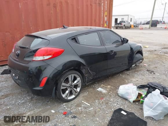 2014 Hyundai Veloster with VIN KMHTC6AD6EU182596, listed as a IAAI auction lot 41498382 with 99,376 mi miles and . Bid and sale history available at DreamBid. Image 4.