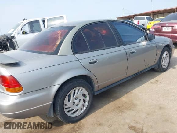 1999 Saturn SL z VIN 1G8ZK5274XZ319152, wystawiony jako IAAI lot #42315756 z przebiegiem Nie podano mil oraz . Historia ofert i sprzedaży dostępna na DreamBid. Obrazek 4.