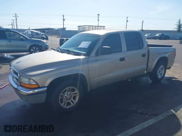 2004 Dodge Dakota SLT with VIN 1D7HL48N44S504617, listed as a IAAI auction lot 41955400 with 196,096 mi miles and . Bid and sale history available at DreamBid. Image 19.