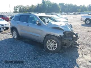 2020 Jeep Grand Cherokee Laredo E with VIN 1C4RJEAG9LC219863, listed as a IAAI auction lot 43070392 with 197,110 mi miles and . Bid and sale history available at DreamBid. Image 1.