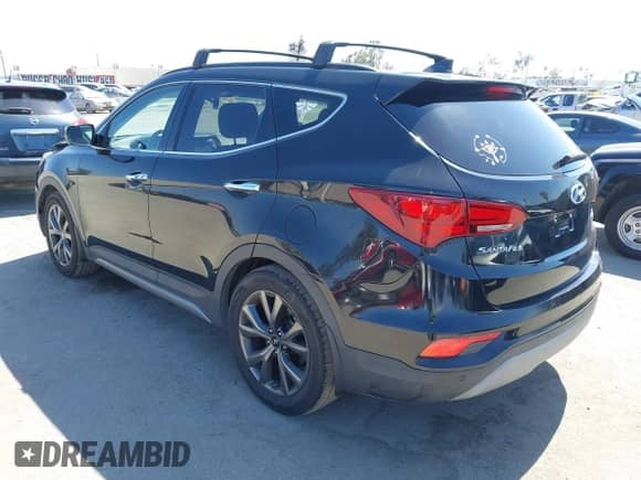 2018 Hyundai Santa Fe Ultimate z VIN 5XYZW4LAXJG551792, wystawiony jako IAAI lot #42414750 z przebiegiem 144 327 mil mil oraz . Historia ofert i sprzedaży dostępna na DreamBid. Obrazek 3.