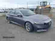 2018 Honda Accord Touring z VIN 1HGCV2F97JA031923, wystawiony jako IAAI lot #42509247 z przebiegiem 61 988 mil mil oraz . Historia ofert i sprzedaży dostępna na DreamBid. Obrazek 1.