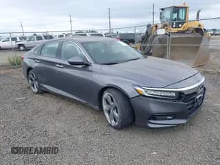 2018 Honda Accord Touring with VIN 1HGCV2F97JA031923, listed as a IAAI auction lot 42509247 with 61,988 mi miles and . Bid and sale history available at DreamBid. Image 1.