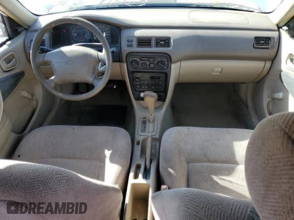 2001 Chevrolet Prizm с VIN 1Y1SK52851Z415813, выставлен на аукционе Copart как лот 87837865 с пробегом Не указан миль и Списание • Salvage title. История ставок и продаж доступна на DreamBid. Изображение 8.