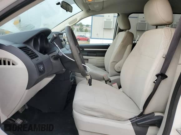 2009 Dodge Grand Caravan with VIN 2D8HN11E79R682979, listed as a Copart auction lot 71230285 with 49,442 mi miles and Salvage title. Bid and sale history available at DreamBid. Image 7.