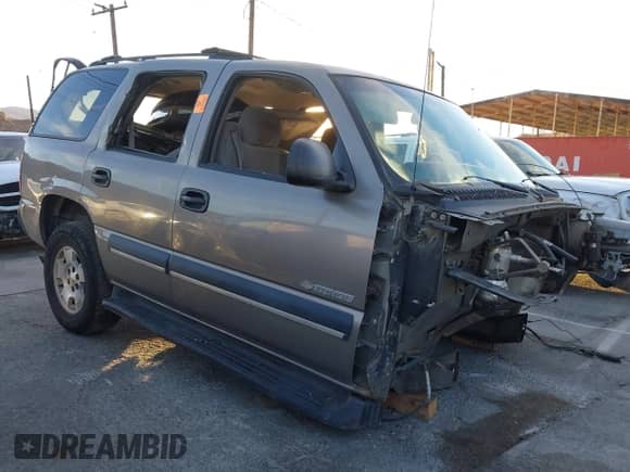 2003 Chevrolet Tahoe LS z VIN 1GNEC13T73J337859, wystawiony jako IAAI lot #41154422 z przebiegiem Nie podano mil oraz . Historia ofert i sprzedaży dostępna na DreamBid. Obrazek 1.